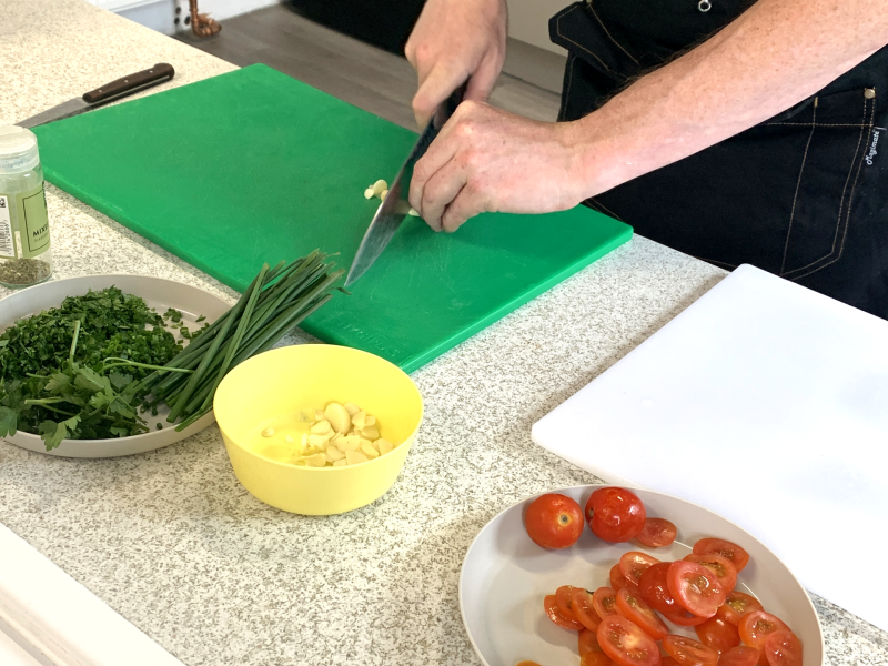 person chopping vegetables