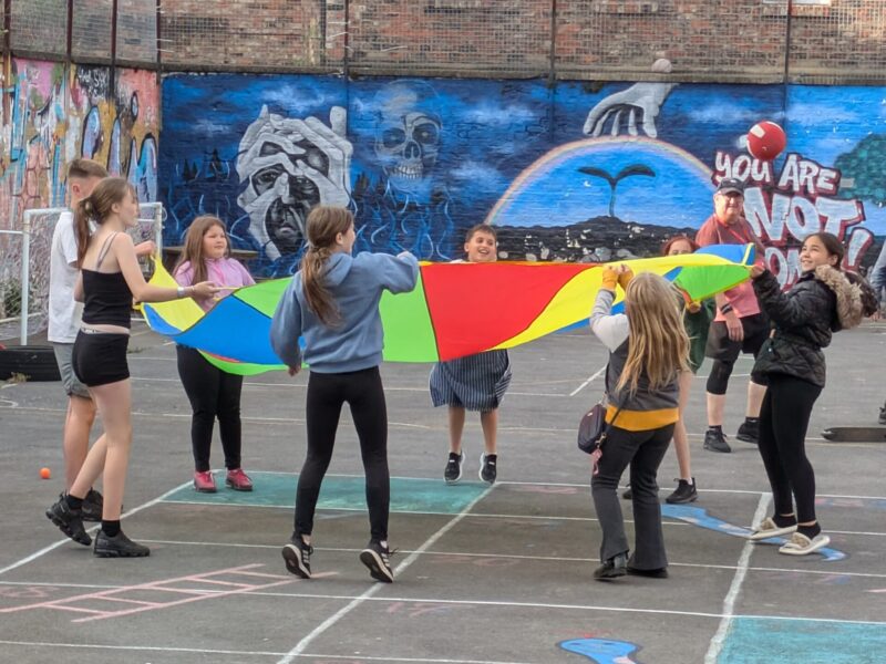 attendees playing with flag