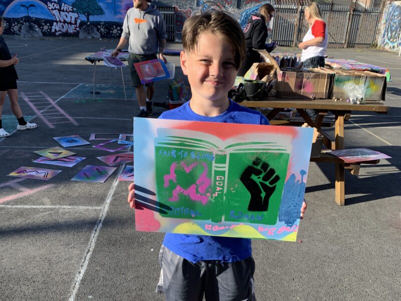 person holding painting