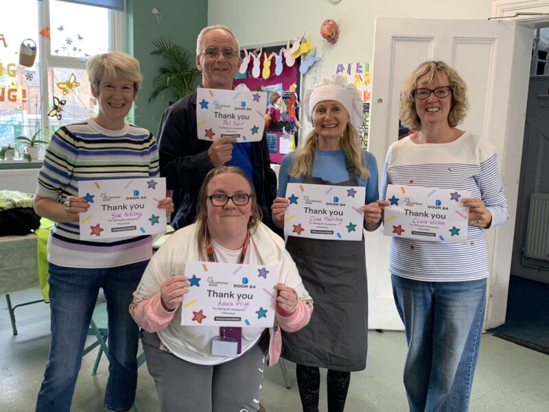 image of volunteers with certifictaes