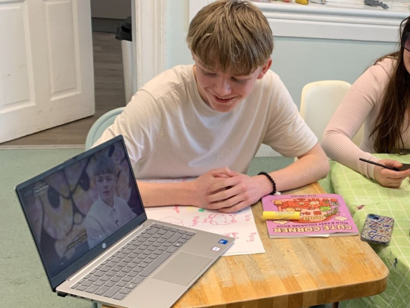 young person watching lap top