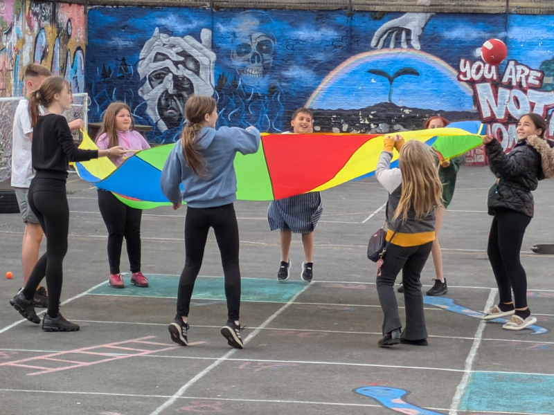 kids playing the parachute game